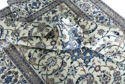 Surface texture of 2000s Nain rug with natural Wool and intricate pattern