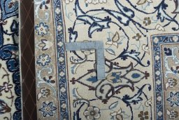 Backside of handmade 2000s Nain rug showing knot structure and weave density