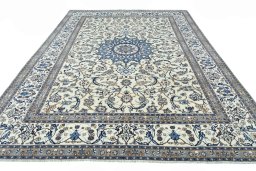 Surface texture of 2000s Nain rug with natural Wool and intricate pattern