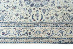 Corner detail of New Nain rug showing border pattern and Wool pile