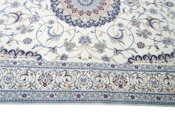 Corner detail of New Nain rug showing border pattern and Cork pile