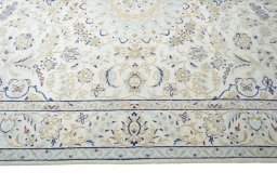Corner detail of New Nain rug showing border pattern and Wool pile