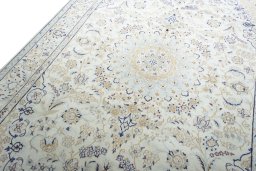 Backside of handmade New Nain rug showing knot structure and weave density