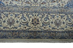 Corner detail of New Nain rug showing border pattern and Wool pile