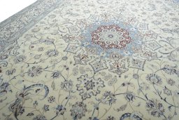 Backside of handmade New Nain rug showing knot structure and weave density
