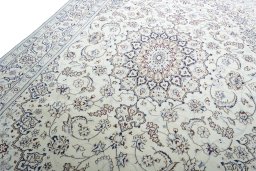 Backside of handmade New Nain rug showing knot structure and weave density