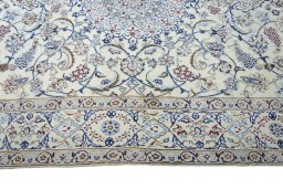 Corner detail of New Nain rug showing border pattern and Wool pile