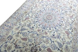 Backside of handmade New Nain rug showing knot structure and weave density