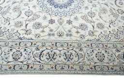 Corner detail of New Nain rug showing border pattern and Wool pile