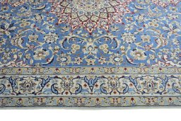 Corner detail of 2000s Nain rug showing border pattern and Wool pile