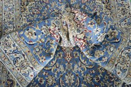 Surface texture of 2000s Nain rug with natural Wool and intricate pattern
