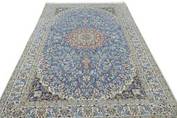 Surface texture of 2000s Nain rug with natural Wool and intricate pattern