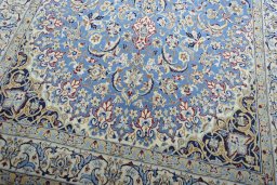 Close-up detail of 2000s Nain rug from Iran / Persia showing Wool weave