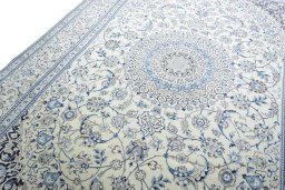 Backside of handmade New Nain rug showing knot structure and weave density