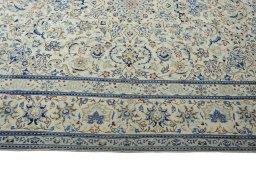 Corner detail of New Nain rug showing border pattern and Wool pile