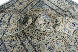 Surface texture of New Nain rug with natural Wool and intricate pattern