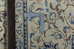 Backside of handmade New Nain rug showing knot structure and weave density