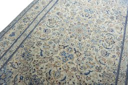 Backside of handmade New Nain rug showing knot structure and weave density