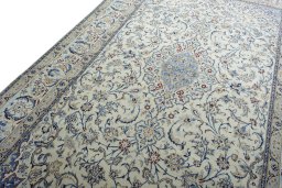 Backside of handmade New Nain rug showing knot structure and weave density