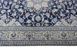 Corner detail of New Nain rug showing border pattern and Wool pile