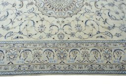 Corner detail of New Nain rug showing border pattern and Wool pile