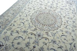 Backside of handmade New Nain rug showing knot structure and weave density