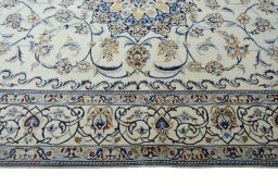 Corner detail of New Nain rug showing border pattern and Wool pile