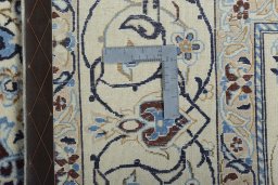 Backside of handmade New Nain rug showing knot structure and weave density