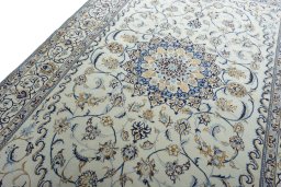 Backside of handmade New Nain rug showing knot structure and weave density