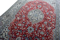 Backside of handmade New Nain rug showing knot structure and weave density