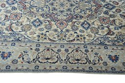 Corner detail of New Nain rug showing border pattern and Wool pile