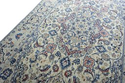 Backside of handmade New Nain rug showing knot structure and weave density