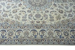 Corner detail of New Nain rug showing border pattern and Silk pile