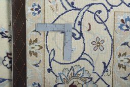 Backside of handmade New Nain rug showing knot structure and weave density