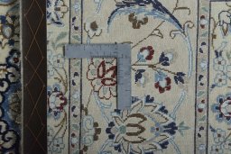 Backside of handmade New Nain rug showing knot structure and weave density