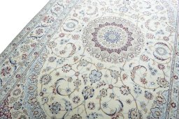 Backside of handmade New Nain rug showing knot structure and weave density