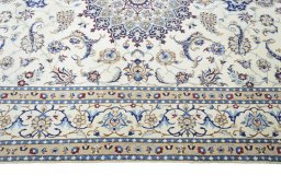 Corner detail of New Nain rug showing border pattern and Wool pile