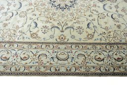 Corner detail of New Nain rug showing border pattern and Wool pile