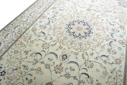 Backside of handmade New Nain rug showing knot structure and weave density