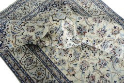 Surface texture of New Nain rug with natural Wool and intricate pattern