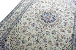 Backside of handmade New Nain rug showing knot structure and weave density
