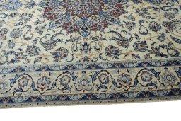 Corner detail of New Nain rug showing border pattern and Wool pile