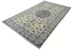 Corner detail of New Nain rug showing border pattern and Wool pile
