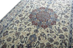 Backside of handmade New Nain rug showing knot structure and weave density