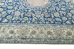 Corner detail of 1970s Nain rug showing border pattern and Cork pile