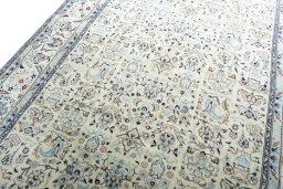 Backside of handmade New Nain rug showing knot structure and weave density