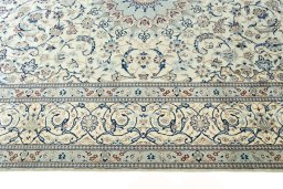 Corner detail of New Nain rug showing border pattern and Wool pile