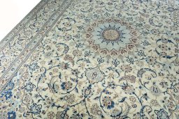 Backside of handmade New Nain rug showing knot structure and weave density