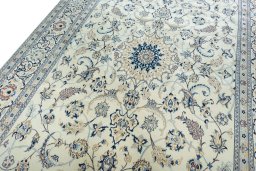 Backside of handmade New Nain rug showing knot structure and weave density
