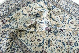 Corner detail of New Nain rug showing border pattern and Wool pile